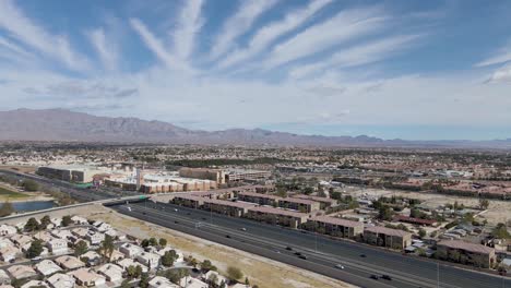 Aerial-View-Of-Traffic-Driving-In-Parkway-Between-Summerlin-In-Las-Vegas-Valley-Of-Southern-Nevada,-USA