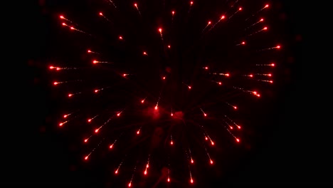 Streaks-and-flashes-of-bright-colorful-night-explode-and-illuminate-the-black-night-sky-during-fireworks-display