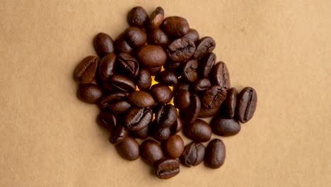 Pile-of-coffee-beans-rotates-in-a-circle-close-up-filming-from-above