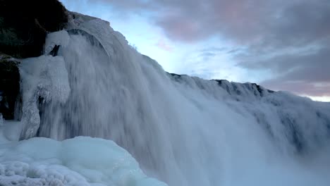 Fast-Flowing-Water-Of-Faxi-Waterfall-With-Icicles-At-Winter-Season-In-Iceland