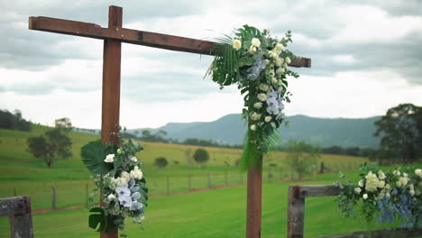 Simple-Wooden-Floral-Arch-For-An-Outdoor-Wedding---medium-shot