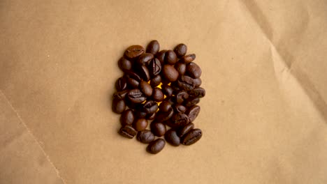 Pile-of-coffee-beans-rotates-in-a-circle-filming-from-above