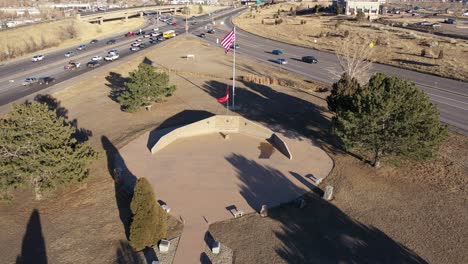 An-orbital-drone-shot-over-a-Marine-memorial,-Golden-Colorado
