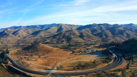 Wide-angle-sliding-aerial-view-of-the-famous-Tehachapi-Loop-on-a-beautiful-day