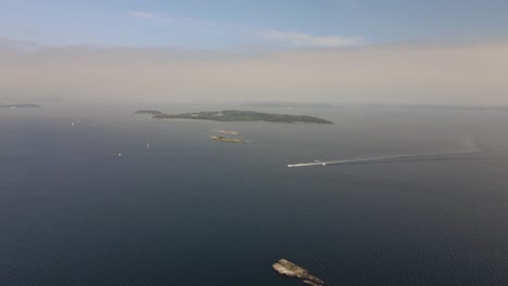 Drone-footage-of-islands-and-sailing-boats-in-Oslofjord,-Southern-Norway