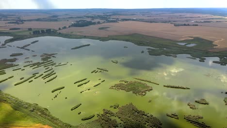 Aerial-shot-of-the-farm-fields-and-wetlands-right-before-the-storm