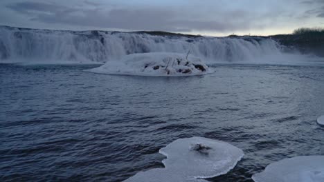 Frozen-River-And-Faxi-Waterfall-At-Dusk-In-Golden-Circle-Iceland