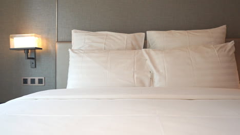 Pan-right-over-hotel-made-up-bed-for-two-person