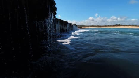 Beautiful-natural-waterfall-in-the-ocean-created-low-tide-in-the-small-beach-town-of-Sibauma-near-Pipa-in-Rio-Grande-do-Norte,-Brazil