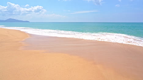 Beautiful-shot-of-waves-crashing-on-golden-beach