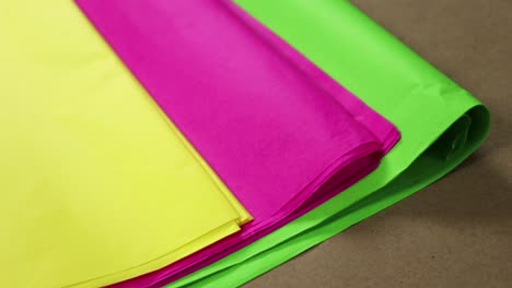 Tissue-paper-in-bright-colors:-yellow,-pink-and-green