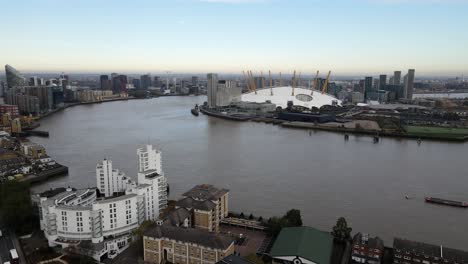 Aerial-panning-shot-of-River-Thames-with-Canary-Wharf-skyline-and-o2-Arena-on-the-other-site-of-river