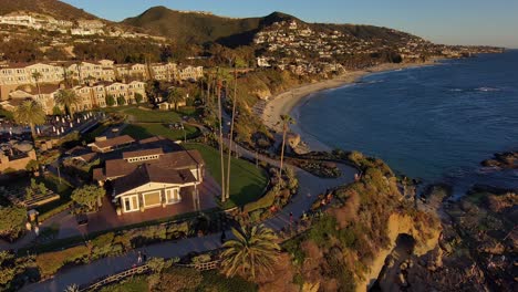 Aerial-drone-view-of-the-Montage-hotel-and-the-path-that-runs-along-Treasure-island-in-Laguna-Beach,-California