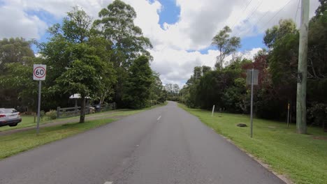 Rear-facing-driving-point-of-view-POV-of-a-deserted-Queensland-country-road-in-Sunshine-Coast-hinterland---ideal-for-interior-car-scene-green-screen-replacement