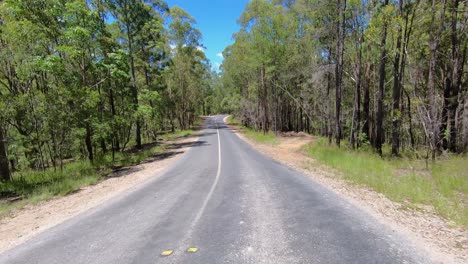 Rear-facing-driving-point-of-view-POV-of-a-deserted-Queensland-country-road-with-dry-dusty-tracks---ideal-for-interior-car-scene-green-screen-replacement