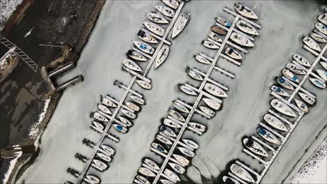 Top-down-aerial-view-of-frozen-marina-at-Lighthouse-Landing-in-Grand-Rivers,-Kentucky