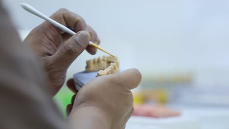 closeup-shot-for-a-technician-preparing-a-denture