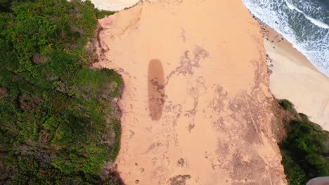 Stunning-view-of-a-tropical-exotic-beach-from-above-with-golden-sand-and-blue-water