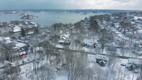 Drone-crane-up-shot-of-Hingham,-MA-after-a-snowstorm