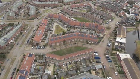 High-Aerial-of-houses-in-suburban-neighbourhood-with-solar-panels-on-rooftop