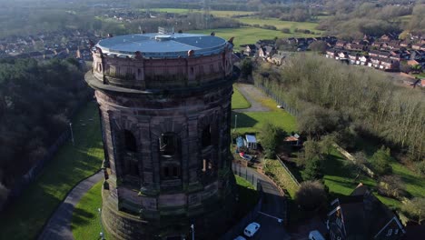 Historical-National-trust-Norton-water-tower-Runcorn-British-aerial-countryside-view-pull-back-rising
