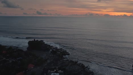 aerial-coastline-view-of-famous-travel-destination-hindu-temple-tanah-lot-during-epic-sunset