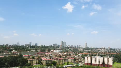 City-scape-of-nairobi-buildings-from-the-nairobi-water-dam-in-kenya,-Drone-flight-capturing-the-city-scape-of-Nairobi-kenya