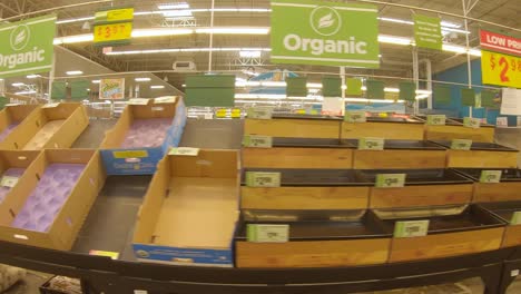 Mostly-empty-produce-bins-at-the-grocery-store-days-after-devastating-winter-storm-Uri