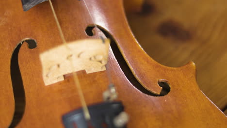 Wooden-old-violin-revealed-in-a-smood-panning-slow-motion