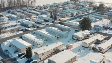 Aerial-of-mobile-home-trailer-park-during-winter-snow
