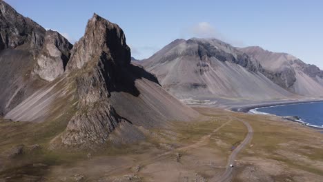 Scenic-mountain-range-Eystrahorn-in-volcanic-landscape-of-Iceland,-aerial