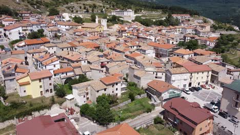 Aerial-landscape-view-over-Pietraroja,-a-hill-top-village,-in-the-Apennines,-Italy