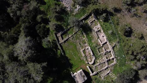 Aerial-view-looking-down-on-the-ruins-of-Pyrgos-tis-Rigenas,-Rigena-Tower-byzantine-monastery-in-Akamas,-Cyprus