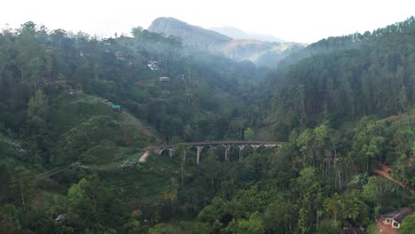 Aerial-footage-of-mountains-and-9-arch-bridge-in-the-morning-in-Ella,-Sri-Lanka