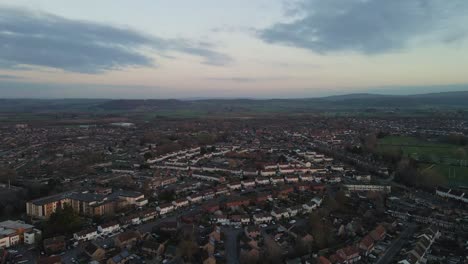 4K-aerial-view-of-taunton-Somerset,-United-Kingdom,-drone-moving-forward-and-showing-the-blue-sky-with-some-clouds