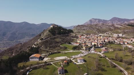 Aerial-landscape-view-of-Pietraroja,-an-italian-village-on-top-of-a-hill,-in-the-Apennines