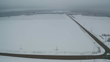 Four-way-intersection-in-snowy-and-wast-frozen-fields-in-America