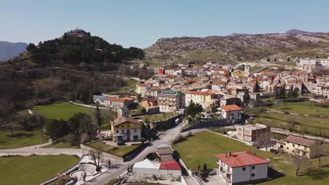 Aerial-view-of-Pietraroja,-an-italian-village-on-a-hill-top,-on-a-sunny-day