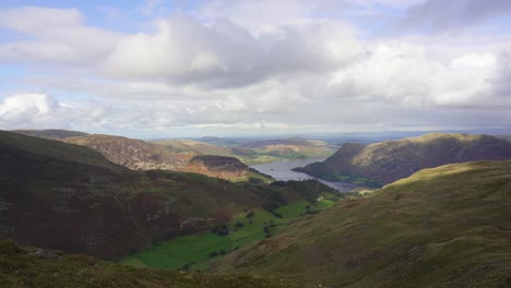 Panning-view-over-the-fells-of-the-Lake-District-looking-toward-Ullswater-and-Glenridding-on-a-bright-cloudy-day