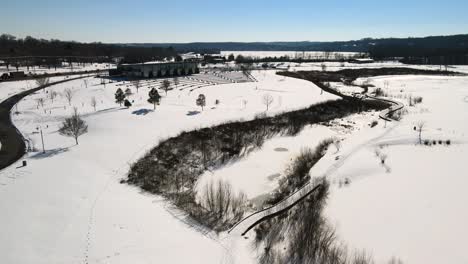 A-flyover-of-frozen-terrain-at-Liberty-Park-in-Clarksville,-Tennessee