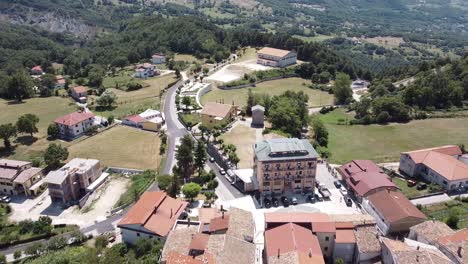 Aerial-view-above-Pietraroja,-an-italian-village-on-top-of-a-hill,-in-the-Apennines