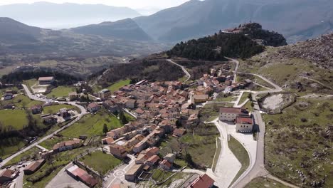 Aerial-landscape-view-of-Pietraroja,-a-hill-top-village-in-Italy,-in-the-Apennines