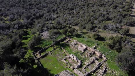 Wide-aerial-drone-shot-flying-over-the-ancient-ruins-of-Pyrgos-tis-Rigenas,-Rigena-Tower-byzantine-monastery-in-Akamas,-Cyprus