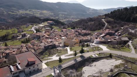 Aerial-landscape-view-above-Pietraroja,-an-italian-hill-top-village,-in-the-Apennines