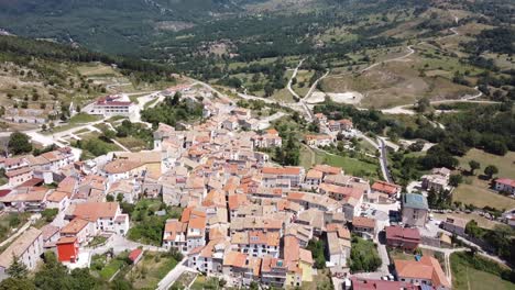 Aerial-landscape-view-above-Pietraroja,-a-hilltop-village,-in-the-Apennines,-Italy