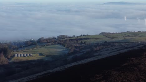 Lancashire-farming-countryside-aerial-cloudy-misty-valley-rural-landscape-pan-left
