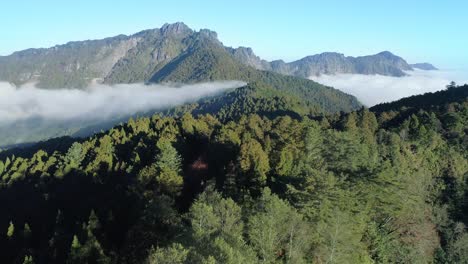 Drone-shot-of-impressive-mountains-in-Asia-with-sea-of-clouds
