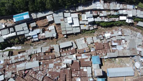 Aerial-view-of-Kibera-metal-rooftops,-largest-slum-in-Africa