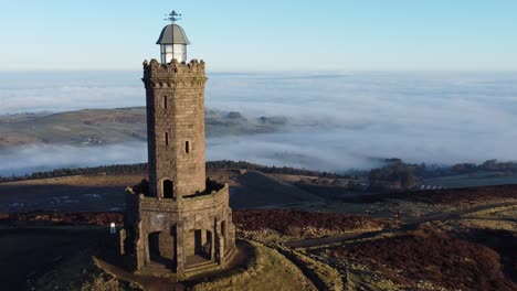 Darwen-Jubilee-tower-sunrise-Lancashire-hillside-misty-valley-moorland-countryside-aerial-fly-past
