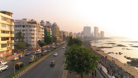 Drone-shots-of-the-most-iconic-walkway-of-South-Bombay,-Marine-Drive,-also-known-as-The-Queen's-Necklace-as-seen-before-The-Great-Mumbai-Coastal-Road-is-made